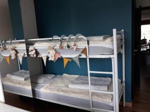 Postel nebo postele na pokoji v ubytování Le char à voile