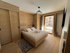 Postel nebo postele na pokoji v ubytování La Terrasse de l Alpe d Huez + 36 fotografií