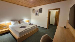 a bedroom with a large bed in a room at Apartmán Kragujevská in Žilina