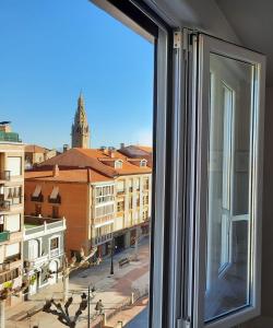 a window with a view of a city at Villa- Belen in Santo Domingo de la Calzada