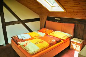 Ein Bett oder Betten in einem Zimmer der Unterkunft Penzion Kameňák