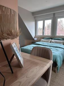 Postel nebo postele na pokoji v ubytování Maison d hôtes SPA Pivoine et Colibri