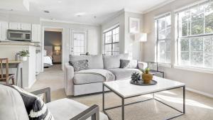 a living room with a couch and a table at Landing Modern Apartment with Amazing Amenities (ID3802X2) in Atlanta