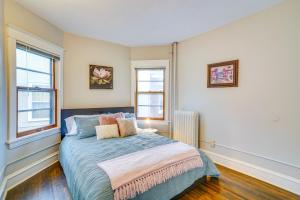a bedroom with a bed and two windows at Cozy Minneapolis Apartment, 1 Mi to Downtown! in Minneapolis