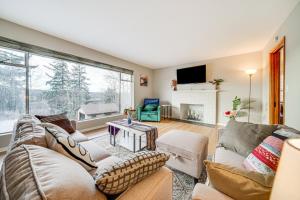 a living room with two couches and a fireplace at Quaint Renton Home about 15 Mi to Downtown Seattle! in Renton