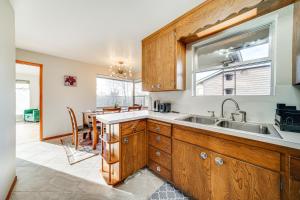 a kitchen with a sink and a window at Quaint Renton Home about 15 Mi to Downtown Seattle! in Renton