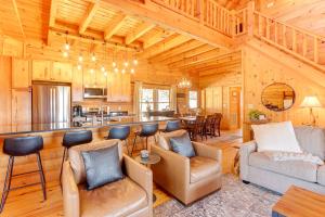 a living room with a bar in a log cabin at Kid-Friendly Morganton Gem 10 Mi to Blue Ridge! in Morganton