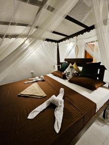 En eller flere senge i et værelse på Balance Beach Resort