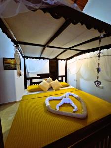 En eller flere senge i et værelse på Balance Beach Resort