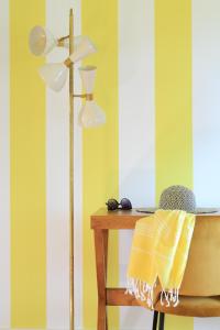 a desk with a lamp and a table with a chair at Hotel Casarose - Cannes Mandelieu in Mandelieu-la-Napoule