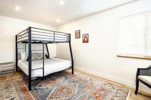 a bedroom with a bunk bed and a rug at Near Downtown Stylish 2BR With Amazing Patio - 5 in Moab