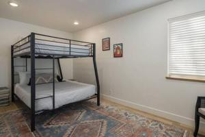 a bedroom with a bunk bed in a room at Near Downtown Stylish 2BR With Amazing Patio - 6 in Moab