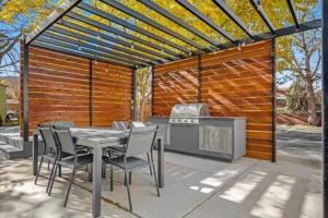 a patio with a table and chairs and a grill at Near Downtown Stylish 2BR With Amazing Patio - 6 in Moab