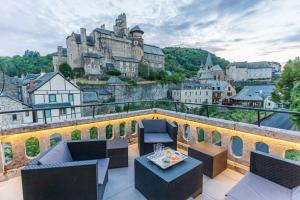 a balcony with a view of a castle at L'Estagnole pour 2 personnes, jacuzzi, hammam in Estaing