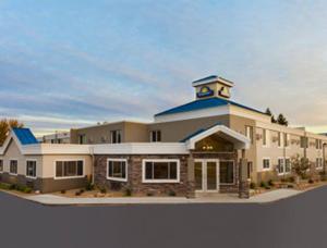 a building with a clock tower on top of it at Days Inn by Wyndham Bismarck in Bismarck