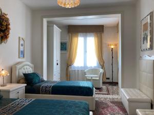 a bedroom with two beds and a window at Oasis Lagoon Estate in Venice-Lido