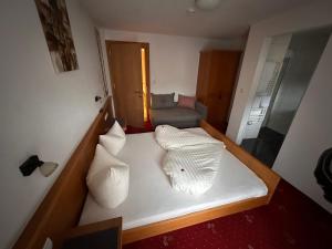 Postel nebo postele na pokoji v ubytování Hotel Andrea