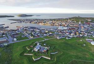 an aerial view of a small town with a harbor at Tunfisk II in Vardø