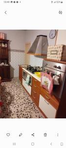a kitchen with a stove and a stove top oven at Al casale in Capriglia