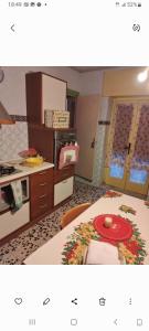 a kitchen with a table with a red plate on it at Al casale in Capriglia
