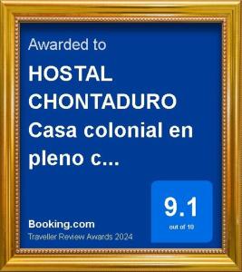 a picture of a sign in a gold frame at HOSTAL CHONTADURO Casa colonial en pleno centro histórico de Cali- Se alquila la casa entera para 12 o 13 personas o por habitaciones in Cali