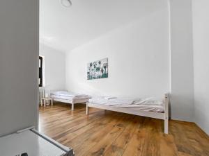 Posteľ alebo postele v izbe v ubytovaní CityChalet Monteur Apartments