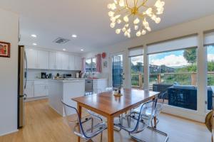 a kitchen and dining room with a table and chairs at Greenbrae Garden Cottage Near Beaches and Redwoods in Green Brae