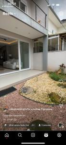 a screenshot of a house with a picture of a garden at Casa na zona sul de Porto Alegre in Porto Alegre