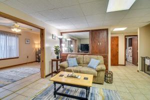 a living room with a couch and a table at Montour Falls Apartment about 3 Mi to Seneca Lake! in Montour Falls