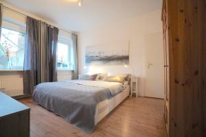 Postel nebo postele na pokoji v ubytování Ferienwohnung Möwe in zentraler Lage