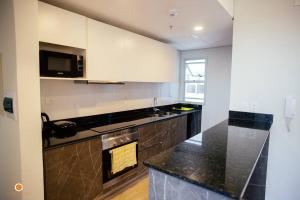 A cozinha ou kitchenette de Cookandmusicapartments Forvm Molas Lopez