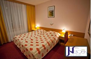 Łóżko lub łóżka w pokoju w obiekcie Hotel Nebojša Jahorina