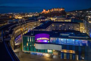 a view of a city at night at Sheraton Grand Hotel & Spa in Edinburgh
