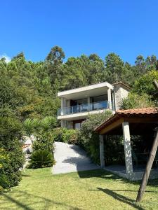 a house on a hill with a yard at Fontainha House & SPA in Caldelas