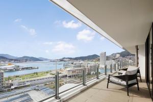 a balcony with a view of the water at Nagasaki Marriott Hotel in Nagasaki