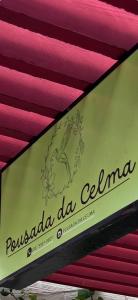 a sign that says pucadia de la ceena on a ceiling at Pousada da Celma in Fortaleza