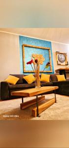 a living room with a couch and a coffee table at Apartman Marijana in Novi Sad