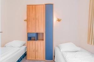 Säng eller sängar i ett rum på Goldene Ruh Wohnung 405