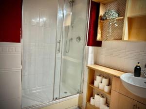 a bathroom with a shower and a sink at 5 Bedroom House-Sleeps 13-Big Savings On Long Stays! in Colchester