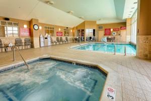 a large indoor pool in a hotel room at Drury Inn & Suites Indianapolis Northeast in Indianapolis