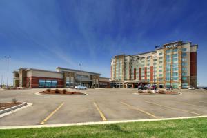 a large parking lot in front of a shopping center at Drury Plaza Hotel Cape Girardeau Conference Center in Cape Girardeau
