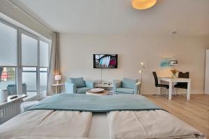 Postel nebo postele na pokoji v ubytování Am Kardohr 3 Am Kardohr 3 Beachway Appartement 12 + 14 fotografií