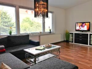 a living room with a couch and a coffee table at Ferienhaus Franzy in Sassnitz