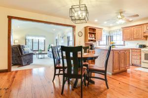 a kitchen and dining room with a table and chairs at Spacious Ronks Getaway with Deck and Grill! in Ronks