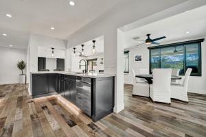 a kitchen and dining room with a table and chairs at Once Upon a Tide - Just Minutes to the Beach in Dania Beach