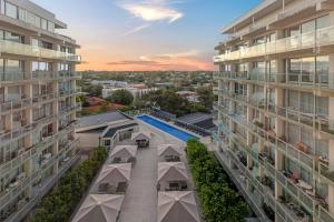 an aerial view of two apartment buildings with a swimming pool at V's Cosy Retreat in Broadview