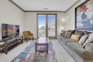 a living room with a couch and a table at San Diego 2 Bedroom Walk to the Mall in San Diego