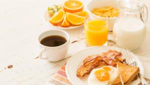 a plate of breakfast food with eggs and toast at Crowne Plaza Toronto Airport, an IHG Hotel in Toronto