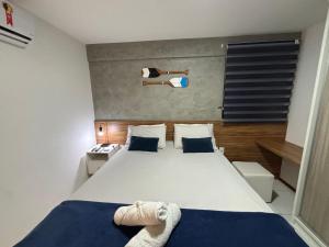 Rúm í herbergi á Apartamentos 250m da Orla -Edifício Nugali- Castelo B Temporada