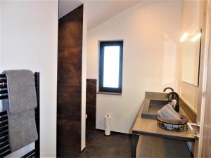 a bathroom with a sink and a window at Chalet Diamond Winterberg 6 Person near by Bikepark Wifi in Winterberg
